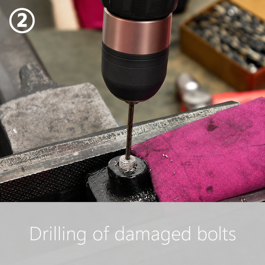 Step 2: a cordless drill and twist bit drilling a pilot hole down the centre of the broken bolt